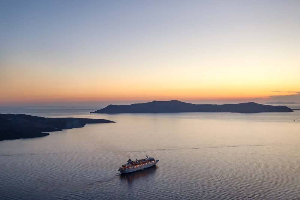 Boat at sea in sunset.